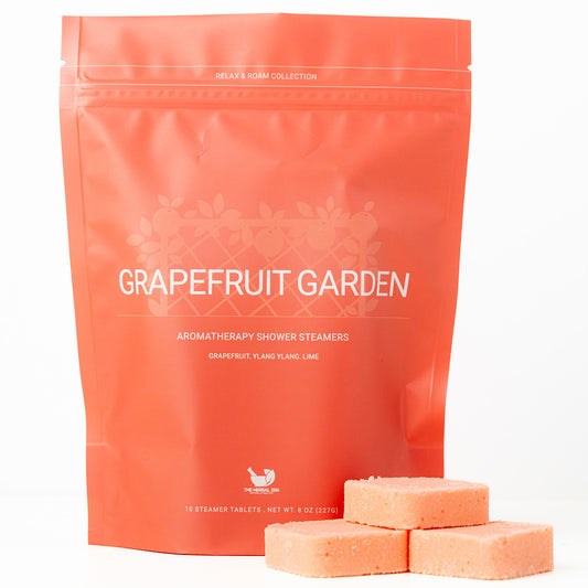 Grapefruit Garden aromatherapy shower steamers with packaging on a white background